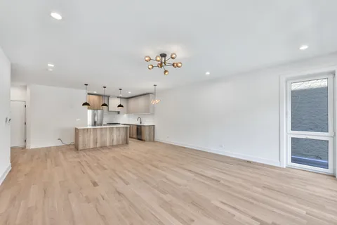a view of kitchen with furniture and wooden floor