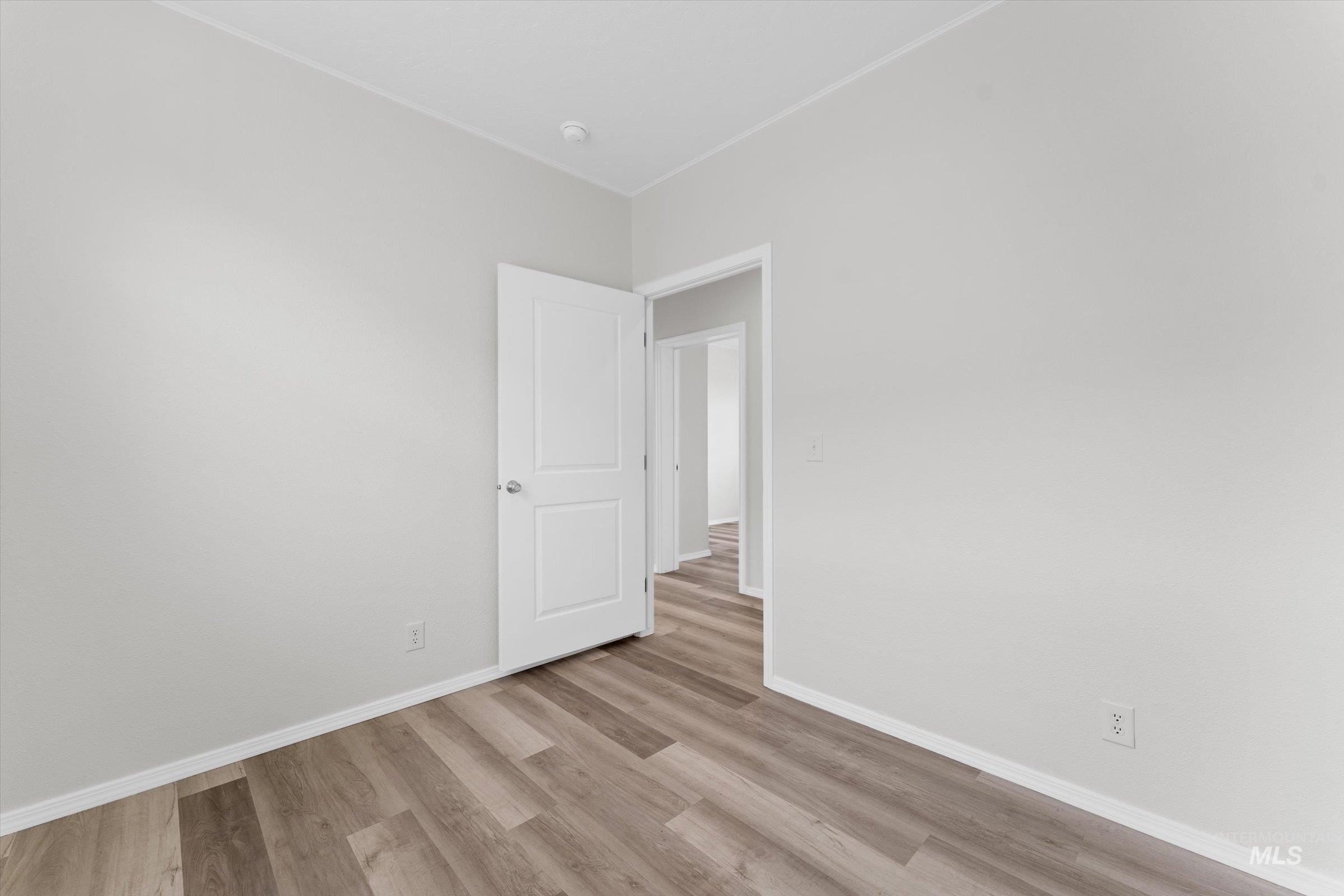 421 South Curtis Road, Unit 34 34 Boise, ID 83705 - Photo 13 of 22 Spare room with light wood-style floors and baseboards