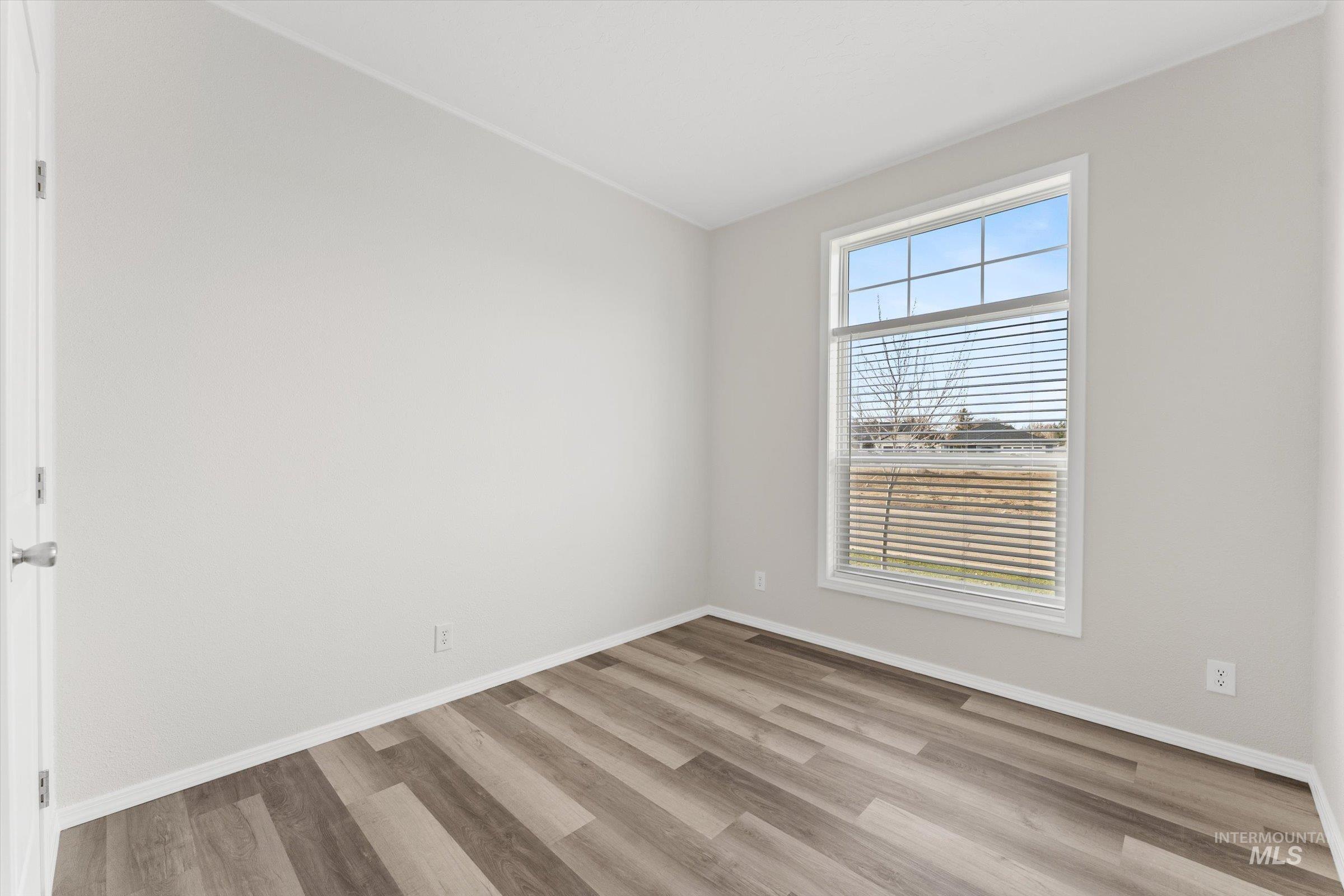 421 South Curtis Road, Unit 34 34 Boise, ID 83705 - Photo 15 of 22 Unfurnished room with light wood-style flooring and baseboards