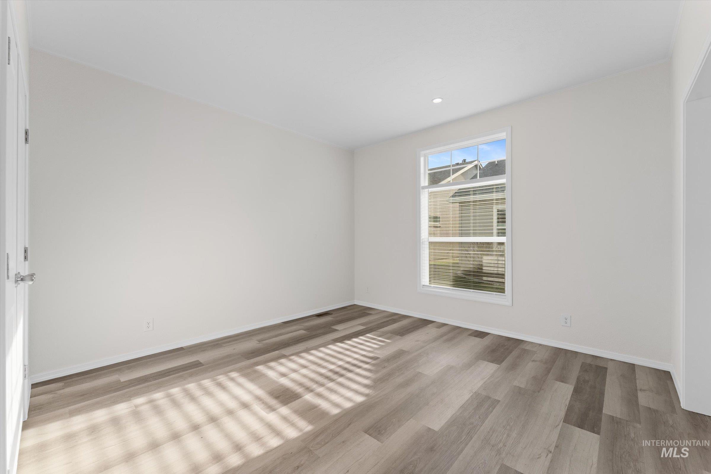 421 South Curtis Road, Unit 34 34 Boise, ID 83705 - Photo 16 of 22 Empty room with light wood-type flooring