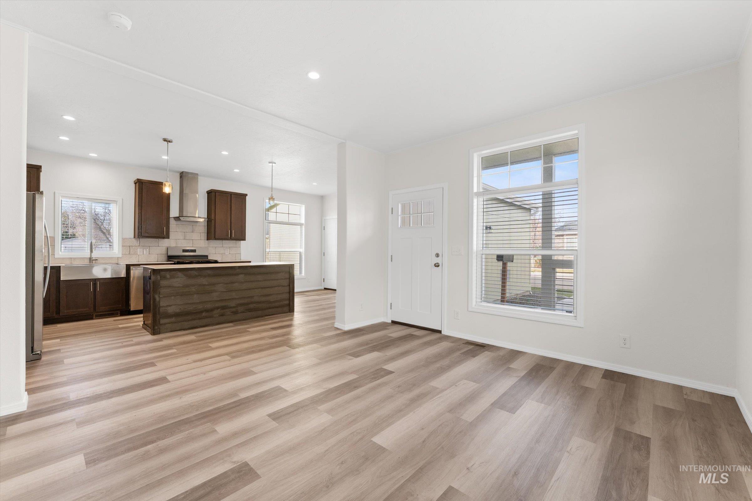 421 South Curtis Road, Unit 34 34 Boise, ID 83705 - Photo 4 of 22 Unfurnished living room with light wood-style floors and recessed lighting