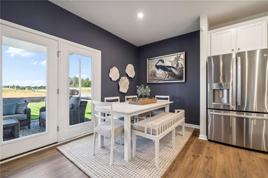 318 Cavalier Lane Acworth, GA 30102 - Photo 11 of 47 a view of a dining room with furniture window and wooden floor