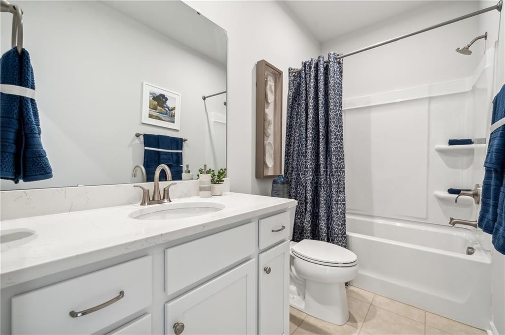 318 Cavalier Lane Acworth, GA 30102 - Photo 21 of 47 a bathroom with a sink a toilet and shower