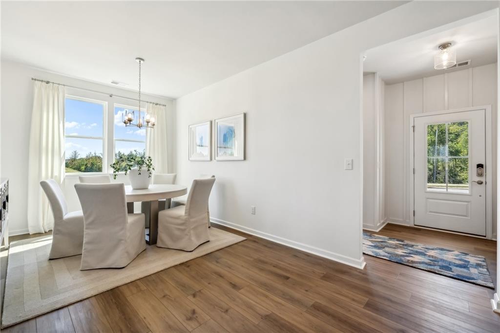 318 Cavalier Lane Acworth, GA 30102 - Photo 3 of 47 a view of a dining room with furniture window and wooden floor
