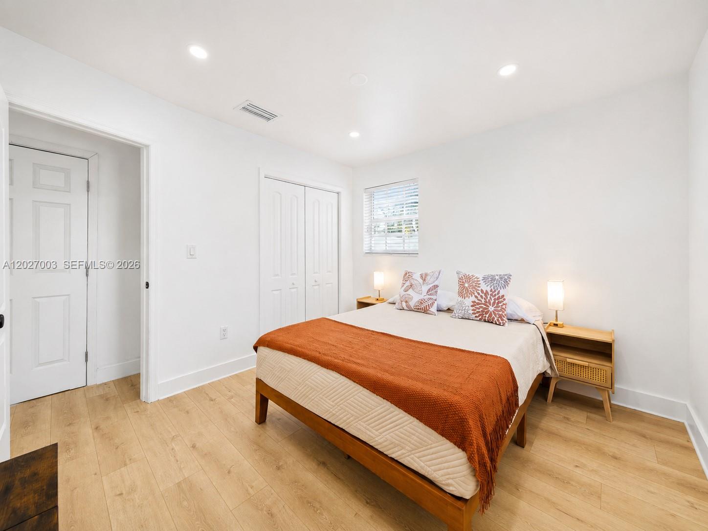 2761 Southwest 92nd Place Miami, FL 33165 - Photo 34 of 37 a bedroom with a bed and a table