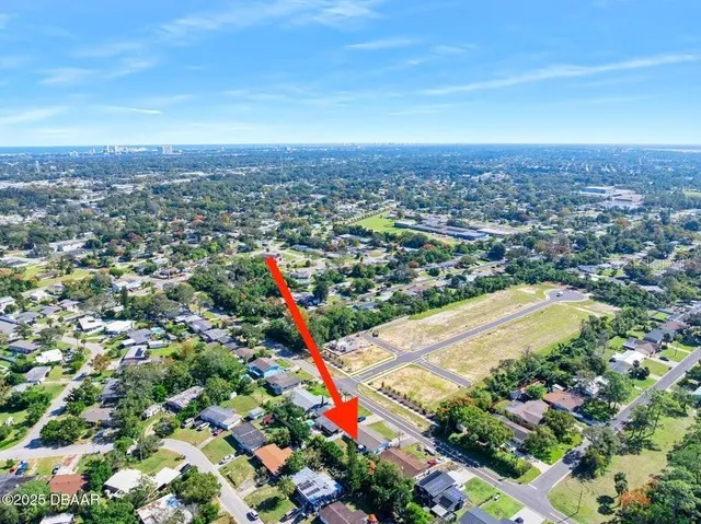an aerial view of residential houses with outdoor space