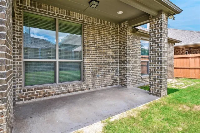 a view of backyard with a garden and entertaining space