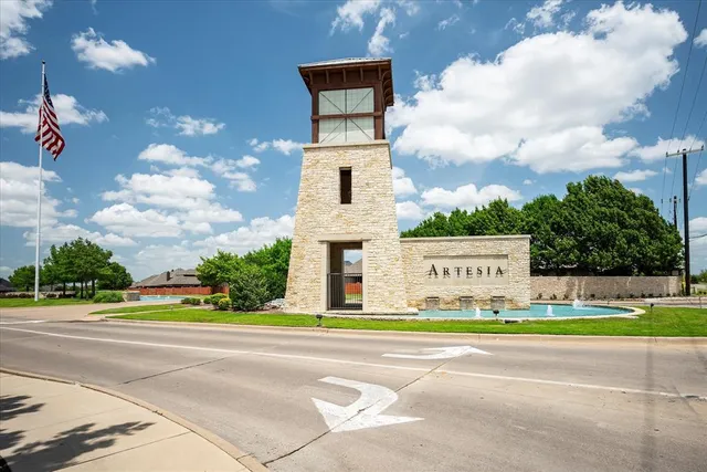 a front view of a house with a garden and entertaining space
