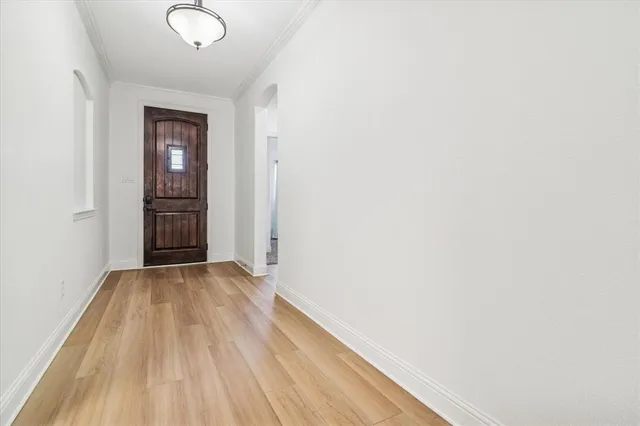 a view of a room with wooden floor and closet