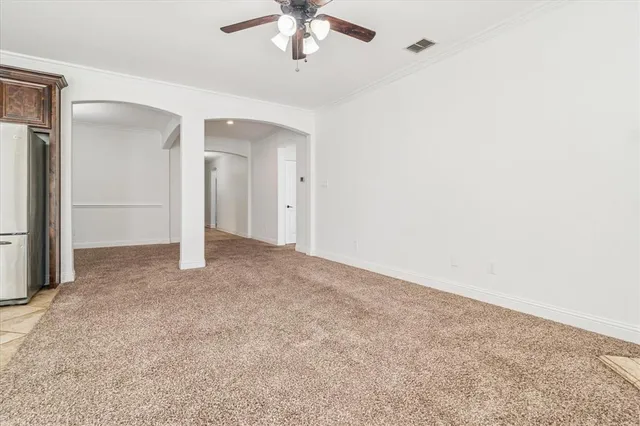a view of an empty room with a chandelier