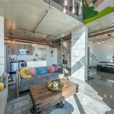 a outdoor living space with furniture and a fireplace