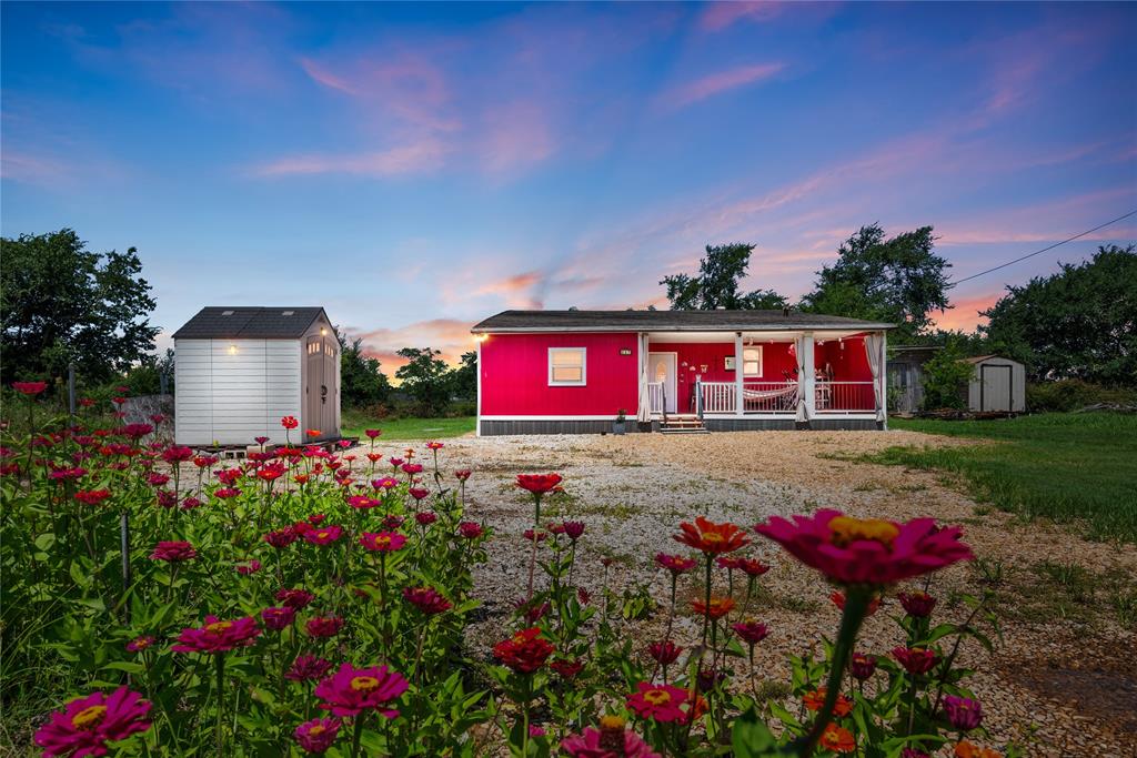 447 Masthead Road Gun Barrel City, TX 75156 - Photo 1 of 27 a view of a house with a yard and garden
