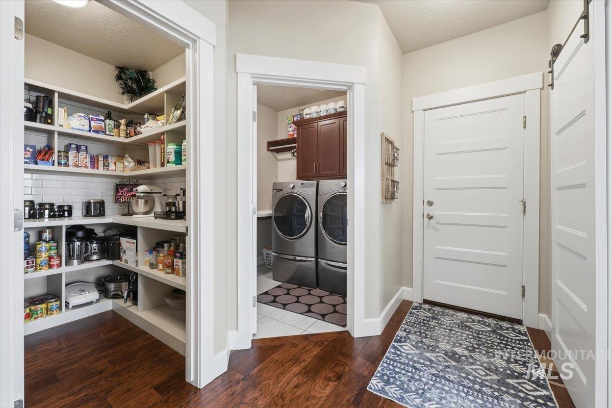 1303 West Brando Street Meridian, ID 83646 - Photo 29 of 49 Spacious pantry with white shelving and subway tile backsplash