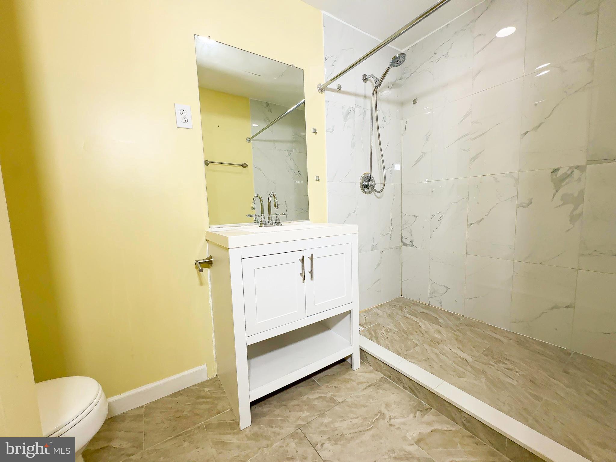 2016 Wheaton Haven Court Silver Spring, MD 20902 - Photo 4 of 10 a bathroom with a sink a toilet and shower