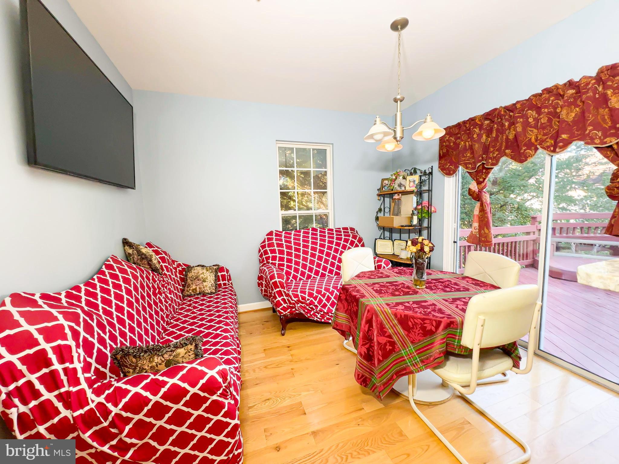 2016 Wheaton Haven Court Silver Spring, MD 20902 - Photo 8 of 10 a bedroom with a bed and wooden floor