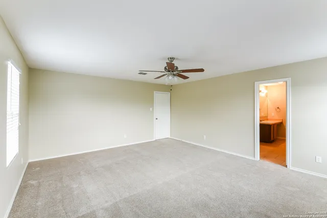 a view of a big room with carpet