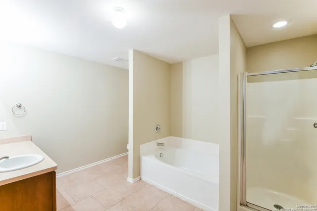 a bathroom with a bathtub and a sink