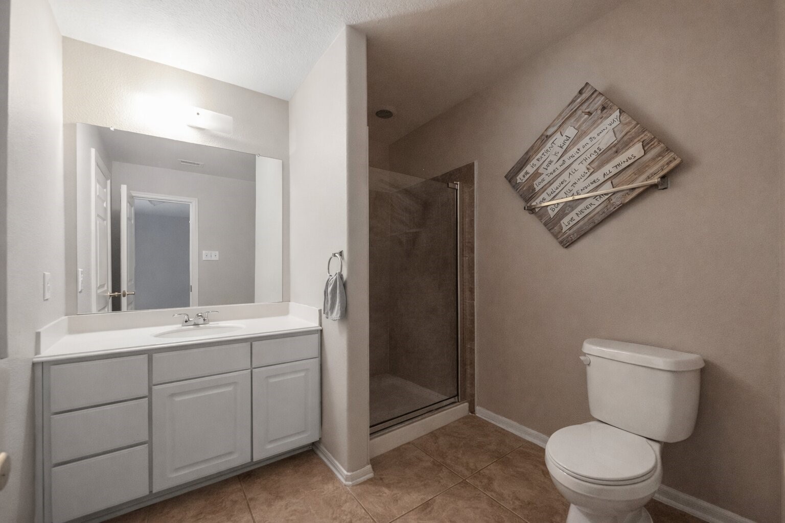 7902 Sesame Street Baytown, TX 77521 - Photo 22 of 24 a bathroom with a toilet a sink and mirror
