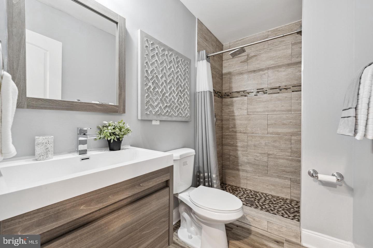 909 19th Street Northeast, Unit 2 Washington, DC 20002 - Photo 17 of 21 Modern bathroom with sleek finishes.