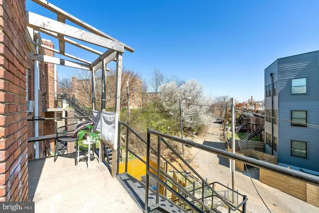a view of a balcony with chairs