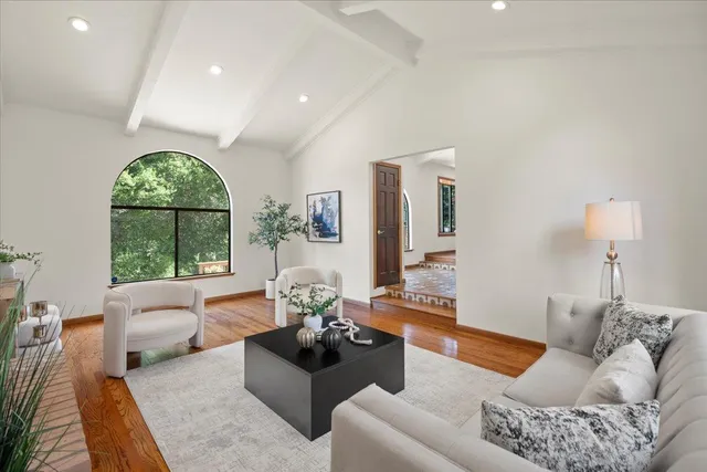 a view of a dining room with furniture wooden floor and chandelier