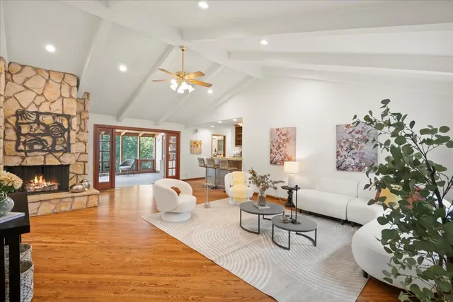 a kitchen with white cabinets and sink