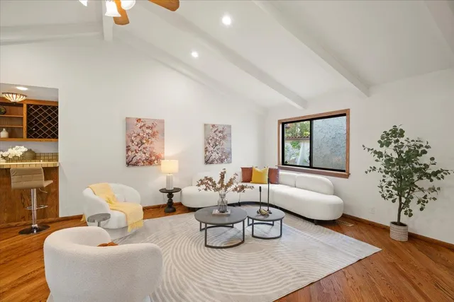 a bed room with a bed and a large window