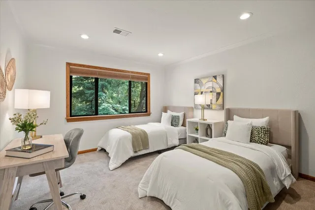 a bathroom with a double vanity sink toilet and a mirror