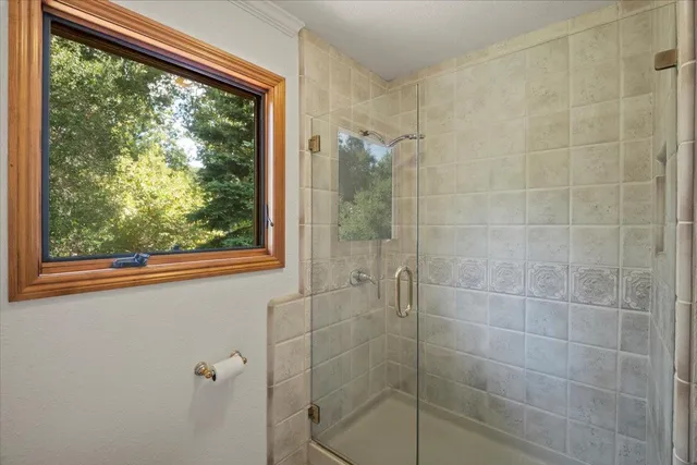 a balcony with wooden floor and outdoor seating