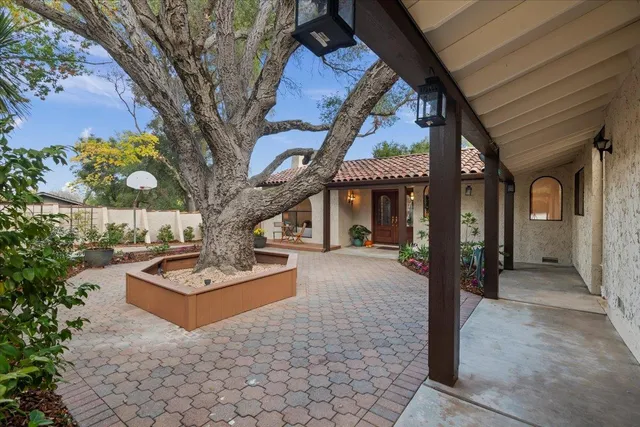 a front view of a house with garden