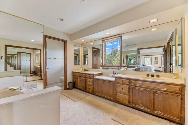 a living room with large glass door and furniture