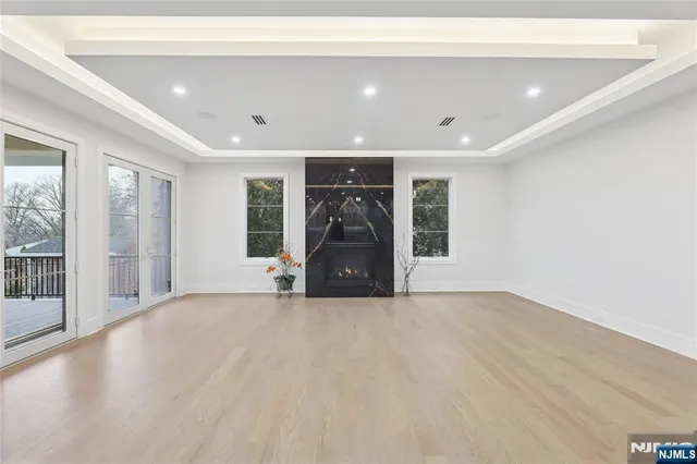 a large bathroom with a double vanity sink a large mirror and a bathtub