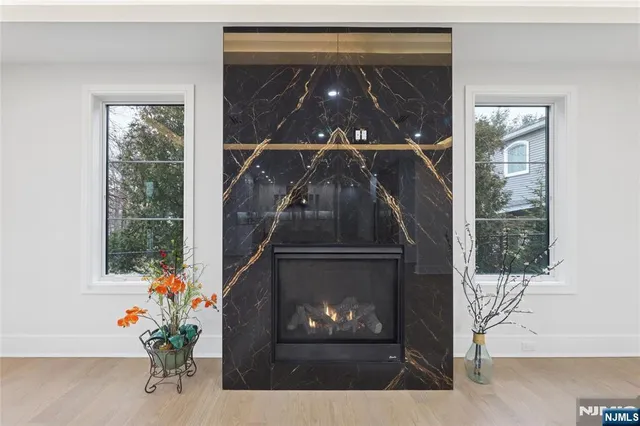 a spacious bathroom with a tub shower and window