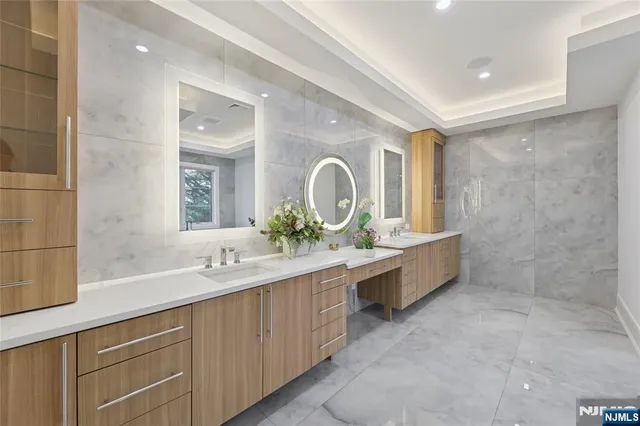 a kitchen with kitchen island a sink appliances and a counter top space