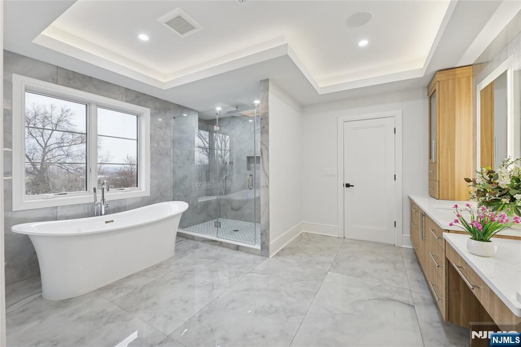 311 North Farview Avenue Paramus, NJ 07652 - Photo 26 of 50 a spacious bathroom with a tub shower and window