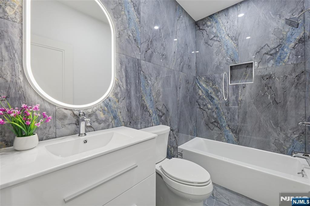 311 North Farview Avenue Paramus, NJ 07652 - Photo 34 of 50 a bathroom with a sink toilet and shower