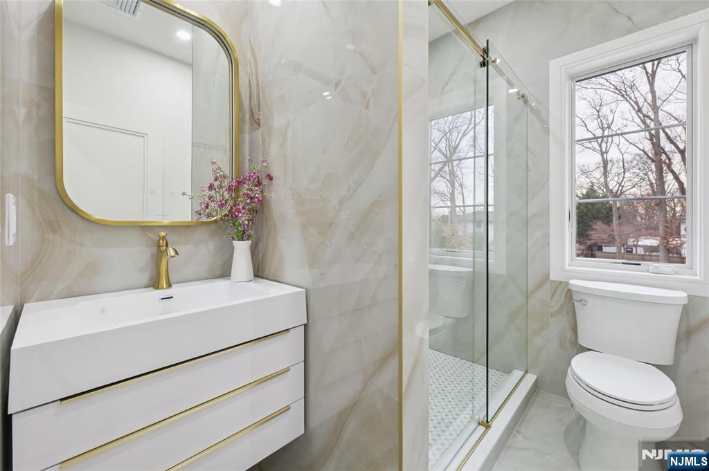 311 North Farview Avenue Paramus, NJ 07652 - Photo 36 of 50 a bathroom with a sink toilet and shower