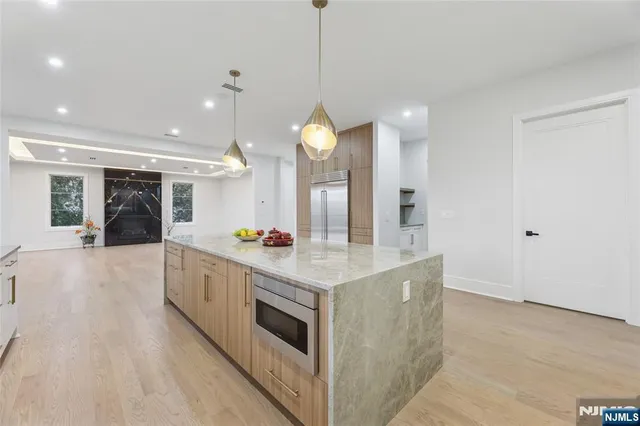 a view of an empty room with a fireplace