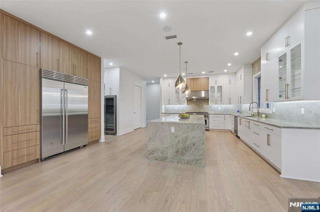 311 North Farview Avenue Paramus, NJ 07652 - Photo 9 of 50 a large kitchen with stainless steel appliances kitchen island granite countertop a large counter top stainless steel appliances and cabinets