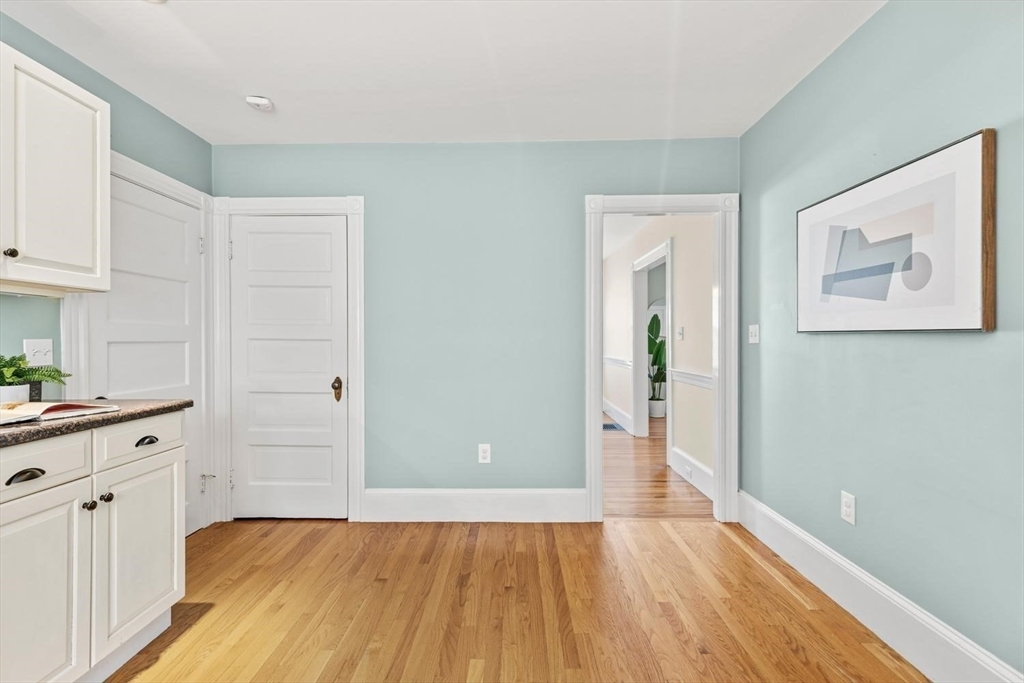 9 Governors Avenue, Unit 2 Winchester, MA 01890 - Photo 15 of 37 a view of a kitchen with wooden floor and a sink