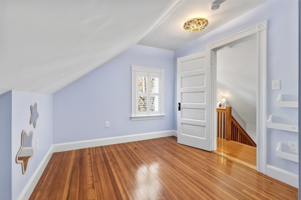 9 Governors Avenue, Unit 2 Winchester, MA 01890 - Photo 19 of 37 a view of empty room with wooden floor