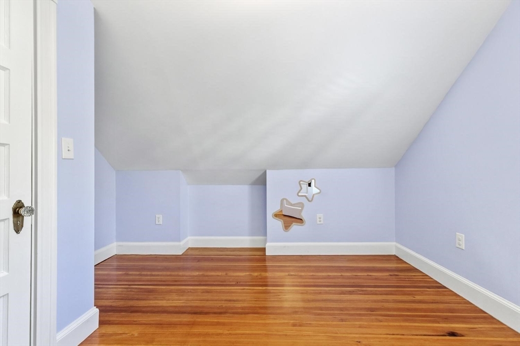 9 Governors Avenue, Unit 2 Winchester, MA 01890 - Photo 20 of 37 a view of empty room with wooden floor
