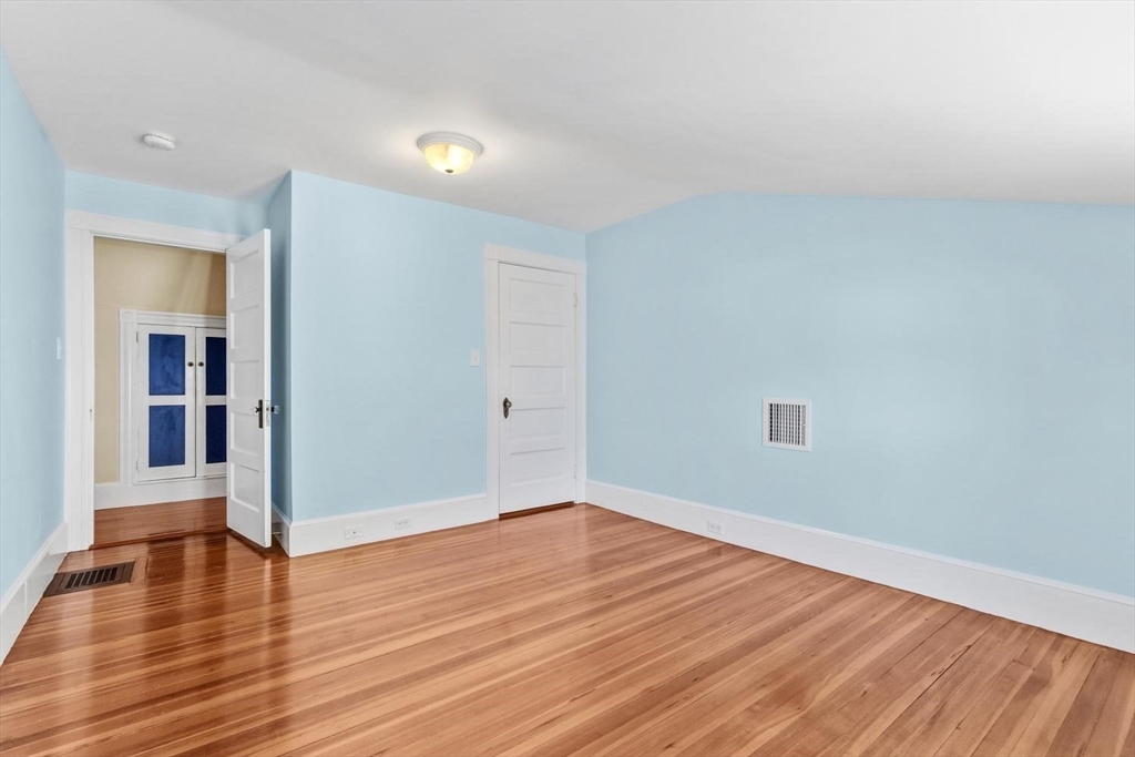 9 Governors Avenue, Unit 2 Winchester, MA 01890 - Photo 21 of 37 a view of empty room with wooden floor