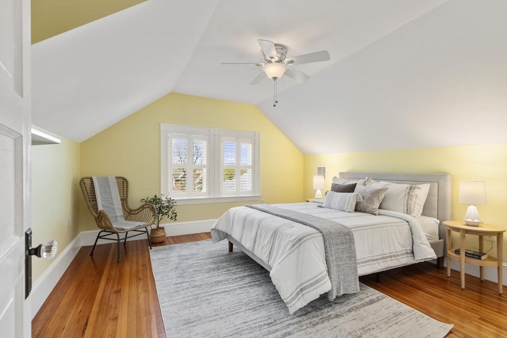 9 Governors Avenue, Unit 2 Winchester, MA 01890 - Photo 24 of 37 a bedroom with a bed and wooden floor