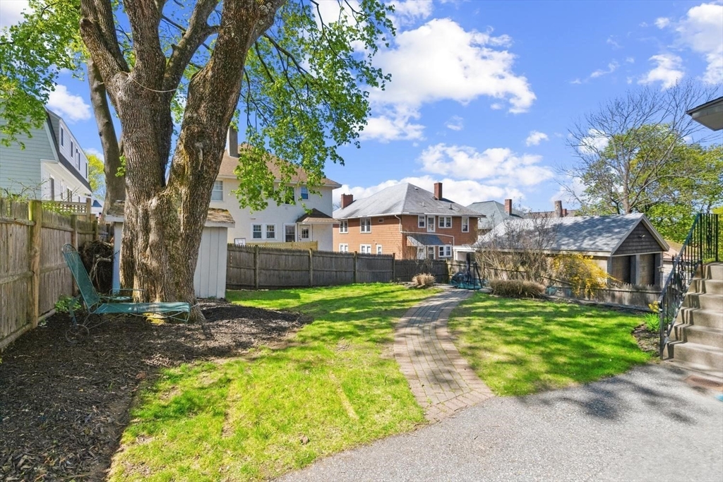 9 Governors Avenue, Unit 2 Winchester, MA 01890 - Photo 28 of 37 a view of a house with a yard