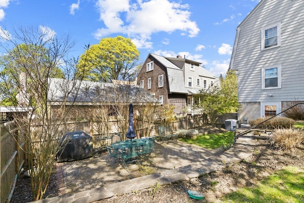 9 Governors Avenue, Unit 2 Winchester, MA 01890 - Photo 31 of 37 a view of a house with a yard