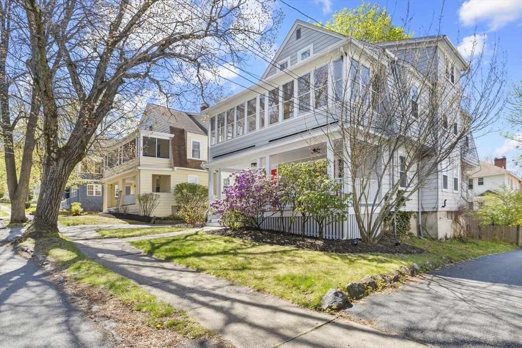 9 Governors Avenue, Unit 2 Winchester, MA 01890 - Photo 35 of 37 a view of a white house with a yard and large tree