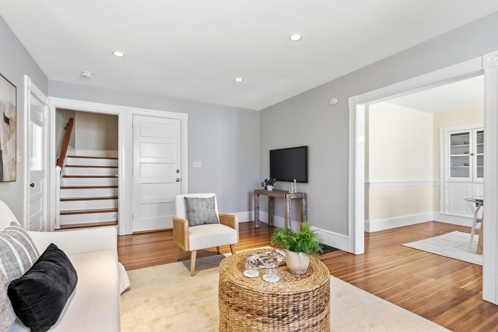 9 Governors Avenue, Unit 2 Winchester, MA 01890 - Photo 6 of 37 a living room with furniture and a flat screen tv