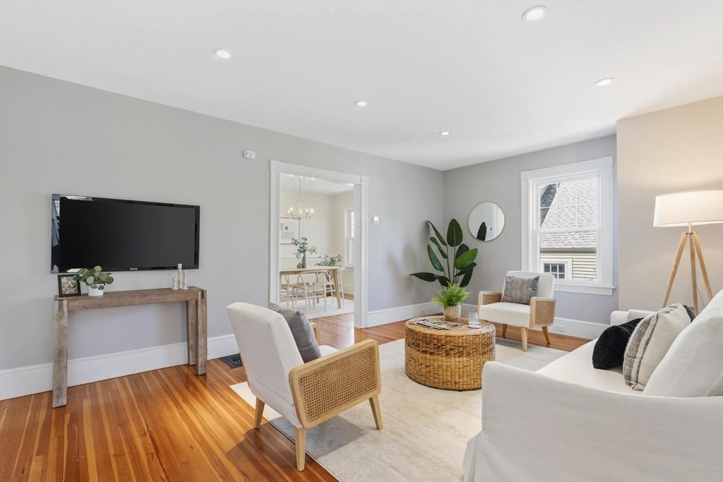 9 Governors Avenue, Unit 2 Winchester, MA 01890 - Photo 7 of 37 a living room with furniture and a flat screen tv