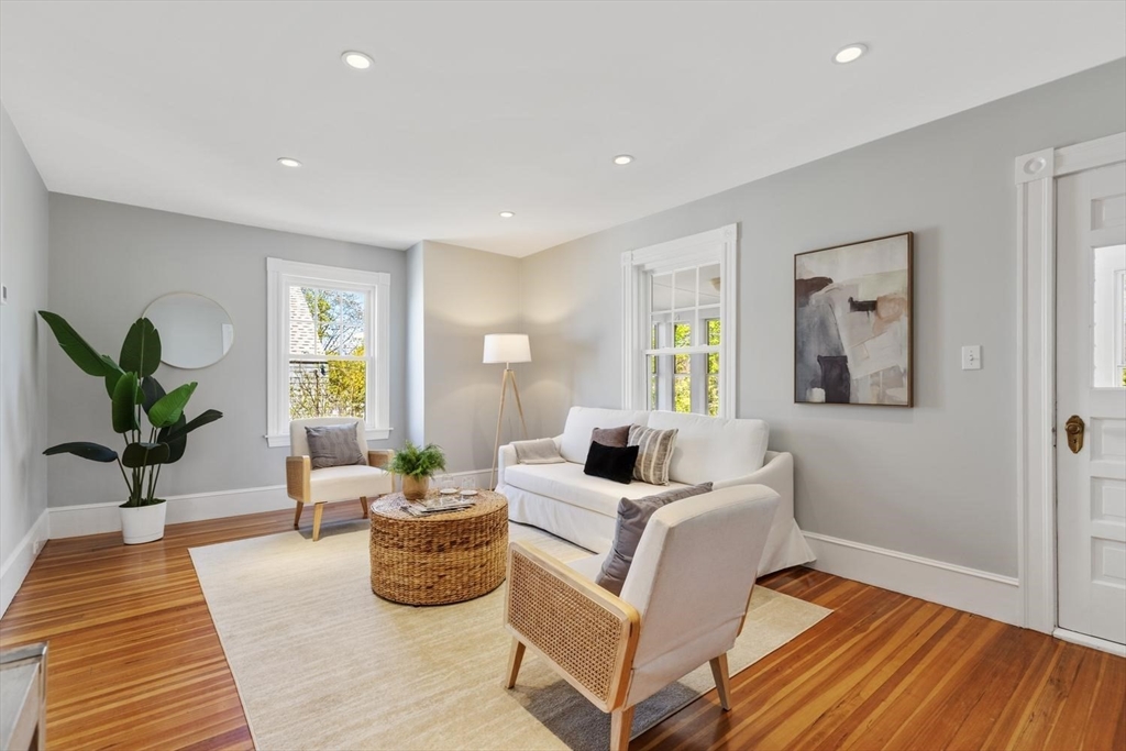 9 Governors Avenue, Unit 2 Winchester, MA 01890 - Photo 8 of 37 a living room with furniture and a potted plant
